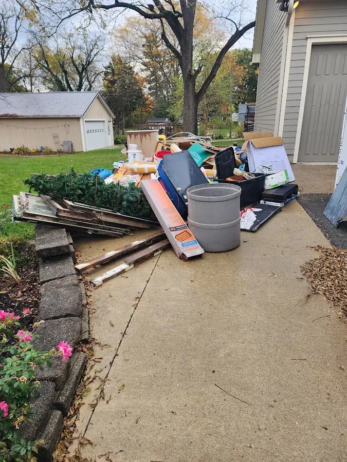 Dumpster being loaded with debris for 30 Yard Dumpster Rental in Mattawa